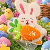 Adorable 6cm mini carrot iced cookie on bunny background card with Easter eggs and spring flowers