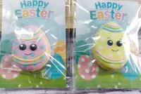 Cute Easter egg shaped iced cookies with colorful decorations on Happy Easter cards