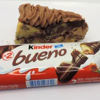 Kinder Bueno cookie cake slice with chocolate ganache and hazelnut filling