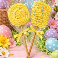 Beautiful yellow passion fruit flavoured meringue pops with sprinkles, tied with yellow ribbons